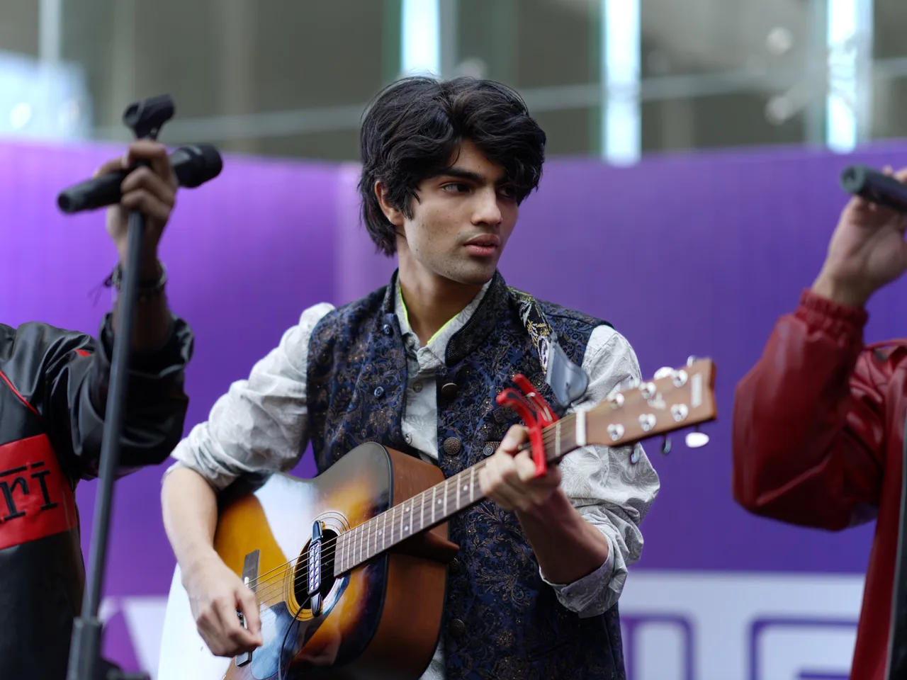 Flux launch event — performer with acoustic guitar