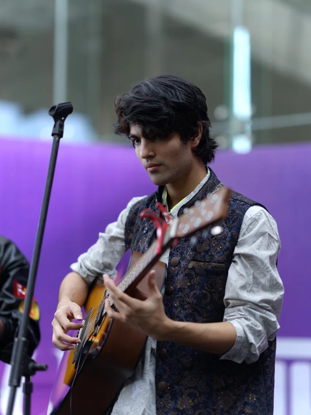 Flux launch event — guitarist on stage